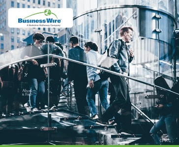 people walking on stairs in a business building