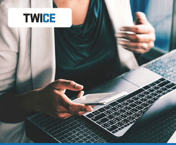 professional woman using trade-in laptop and mobile device